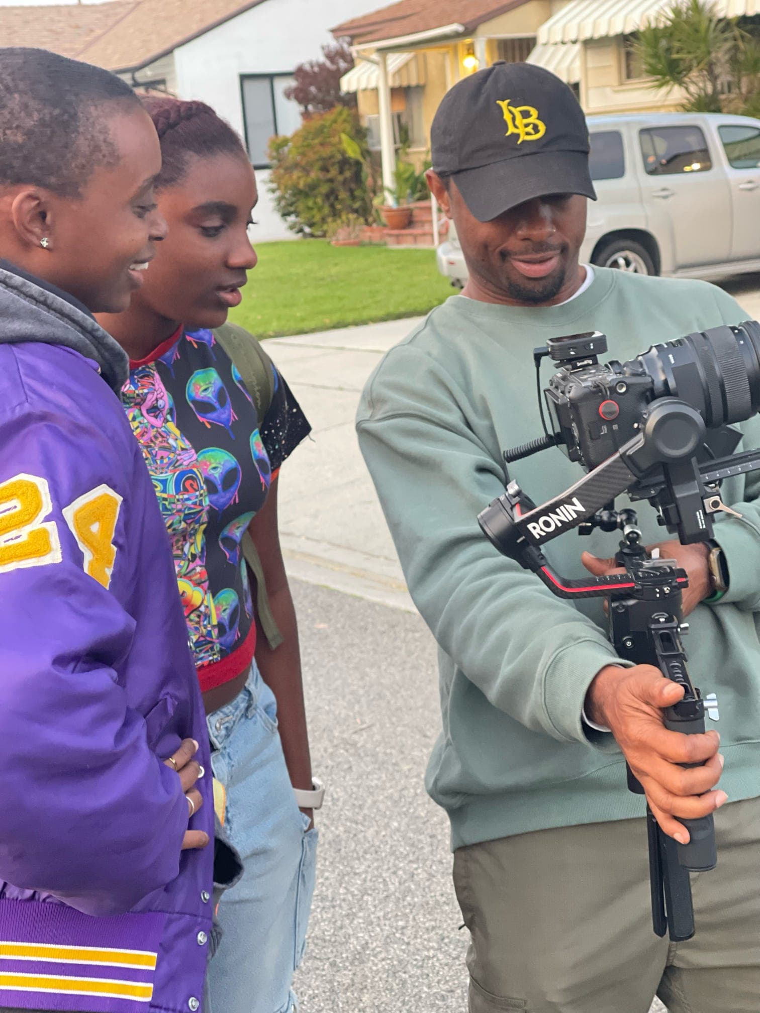 Videographer with DJI Ronin reviewing a shot